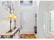 Elegant entry with stained glass and ornate table at 220 Lewis Dr, Davenport, FL 33837
