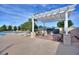 Outdoor kitchen with pergola and seating near the pool at 220 Lewis Dr, Davenport, FL 33837