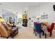 Open concept living and dining area with high ceilings and natural light at 220 Lewis Dr, Davenport, FL 33837