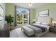 Spacious bedroom with large windows and a cozy sitting area at 220 Lewis Dr, Davenport, FL 33837