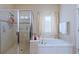 Bathroom with a shower and garden tub at 428 De Soto Ln, Davenport, FL 33837