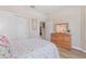 Charming bedroom with floral bedding and wood dresser at 428 De Soto Ln, Davenport, FL 33837