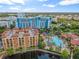 Aerial view of resort community with pool and lake at 12544 Floridays Resort Dr # 109-B, Orlando, FL 32821