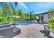Relaxing backyard oasis featuring a refreshing pool and ample patio space for entertaining at 2891 Swoop Cir, Kissimmee, FL 34741