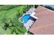 Aerial view showing house, pool, and surrounding landscape at 2891 Swoop Cir, Kissimmee, FL 34741
