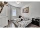 Bedroom with a double bed, nightstands and large window at 2891 Swoop Cir, Kissimmee, FL 34741