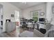 Bright home office with two workstations, hardwood floors, and built-in shelving at 2891 Swoop Cir, Kissimmee, FL 34741