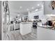 Modern kitchen with white cabinets and granite counters at 2891 Swoop Cir, Kissimmee, FL 34741