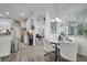 Kitchen with white cabinets, a breakfast nook, and wood-look floors at 2891 Swoop Cir, Kissimmee, FL 34741