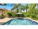 Beautiful pool and patio area with ample seating and lush landscaping at 2891 Swoop Cir, Kissimmee, FL 34741
