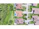 Aerial view of a house and neighborhood, showcasing landscaping and location at 2891 Swoop Cir, Kissimmee, FL 34741