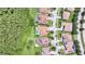 Aerial view of a community with houses, lush greenery and neighborhood roads at 2891 Swoop Cir, Kissimmee, FL 34741