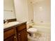 Clean bathroom with a tub, shower, and wood vanity at 3152 Via Otero Dr, Kissimmee, FL 34744