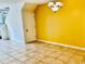 Bright dining area with yellow walls and tile flooring at 3152 Via Otero Dr, Kissimmee, FL 34744