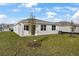 New home with backyard and covered patio at 4056 Bannock Ave, Tavares, FL 32778