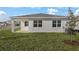 New home with backyard and covered patio at 4056 Bannock Ave, Tavares, FL 32778