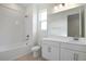 Bathroom with white vanity, tile flooring, and a bathtub at 4056 Bannock Ave, Tavares, FL 32778