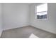 Spacious bedroom with neutral walls, new carpet, and a large window at 4056 Bannock Ave, Tavares, FL 32778