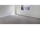 Spacious bedroom with neutral carpeting and large window at 4056 Bannock Ave, Tavares, FL 32778