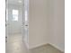 Bright laundry room with tile flooring and built-in storage at 4056 Bannock Ave, Tavares, FL 32778