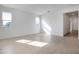 Bright and spacious living room with large windows and tile flooring at 4056 Bannock Ave, Tavares, FL 32778