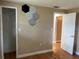 Simple bedroom with wood floors and a closet at 109 N Palm Ave, Kissimmee, FL 34741