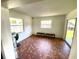 Living room with terracotta tile floor and sliding glass doors at 316 Pennsylvania Ave, Saint Cloud, FL 34769