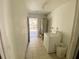 Laundry room with washer, dryer, and access to backyard at 316 Pennsylvania Ave, Saint Cloud, FL 34769