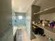 Bathroom with a shower/tub combo, vanity, and storage shelves at 316 Pennsylvania Ave, Saint Cloud, FL 34769