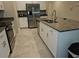 Updated kitchen featuring stainless steel appliances and granite island at 1629 Yellow Trl, Lakeland, FL 33801