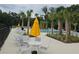 Relaxing pool area with lounge chairs and umbrellas at 1629 Yellow Trl, Lakeland, FL 33801