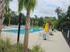Inviting community pool with ample seating at 1629 Yellow Trl, Lakeland, FL 33801