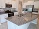 Kitchen with granite countertops, stainless steel appliances, and white cabinets at 1629 Yellow Trl, Lakeland, FL 33801
