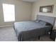 Spacious bedroom with gray carpet and large window at 1629 Yellow Trl, Lakeland, FL 33801
