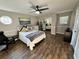 Serene bedroom with a full-size bed and large window at 4251 Willow Bay Dr, Winter Garden, FL 34787