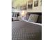 Bedroom with a queen bed, featuring stylish decor at 5245 W Irlo Bronson Memorial Hwy # 234, Kissimmee, FL 34746