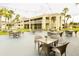 Outdoor patio area with string lights and multiple tables at 5245 W Irlo Bronson Memorial Hwy # 234, Kissimmee, FL 34746