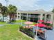 Inviting motel courtyard with tables, umbrellas, and a refreshing pool at 5245 W Irlo Bronson Memorial Hwy # 234, Kissimmee, FL 34746