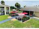 Relaxing patio area with colorful umbrellas and seating at 5245 W Irlo Bronson Memorial Hwy # 234, Kissimmee, FL 34746