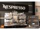 Coffee bar with two Nespresso machines and various drink options at 5245 W Irlo Bronson Memorial Hwy # 234, Kissimmee, FL 34746