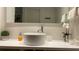 Stylish bathroom with vessel sink and orchid decor at 5245 W Irlo Bronson Memorial Hwy # 234, Kissimmee, FL 34746