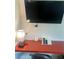 Small workspace with TV, desk, and lamp at 5245 W Irlo Bronson Memorial Hwy # 234, Kissimmee, FL 34746