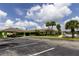 Building exterior with ample parking and landscaping at 5245 W Irlo Bronson Memorial Hwy # 234, Kissimmee, FL 34746