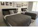 Well-lit bedroom with two double beds and wall art at 5245 W Irlo Bronson Memorial Hwy # 234, Kissimmee, FL 34746
