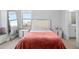 Bright bedroom with a plush coral blanket and full-length mirror at 15620 Panther Lake Dr, Winter Garden, FL 34787
