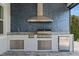 Stainless steel outdoor kitchen with marble countertops at 15620 Panther Lake Dr, Winter Garden, FL 34787