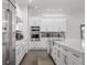 Sleek kitchen with stainless steel appliances and white cabinetry at 15620 Panther Lake Dr, Winter Garden, FL 34787