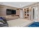 Home theater room with large TV and built-in shelving at 15620 Panther Lake Dr, Winter Garden, FL 34787