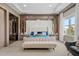 Luxurious main bedroom with large bed and marble accent wall at 15620 Panther Lake Dr, Winter Garden, FL 34787