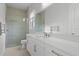 Clean bathroom with walk-in shower and white cabinetry at 15620 Panther Lake Dr, Winter Garden, FL 34787